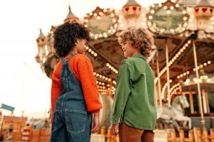 Kids having fun on a carnival Carousel