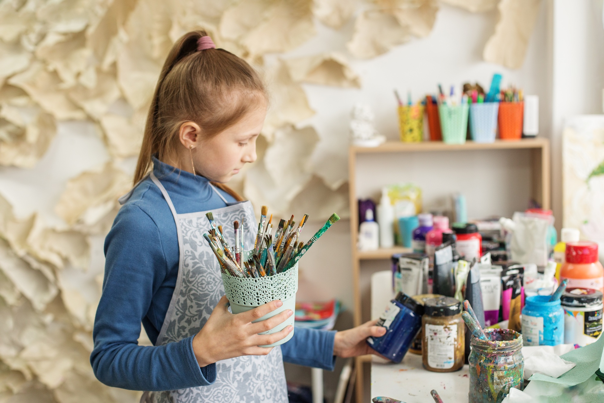 Concentrated Child Preparing Paint for Artwork